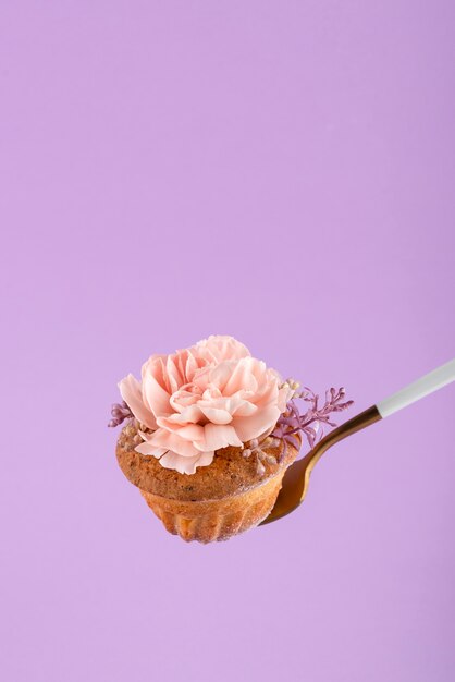 High angle cupcake with flower