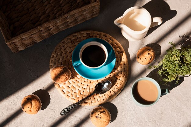 High angle cups of coffee with milk