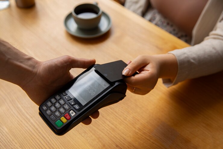 Free Photo high angle customer paying with nfc device