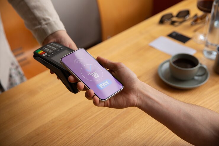 Free Photo high angle customer paying with nfc device