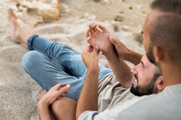 High angle cute couple on sand