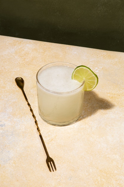 High angle daiquiri cocktail with lime