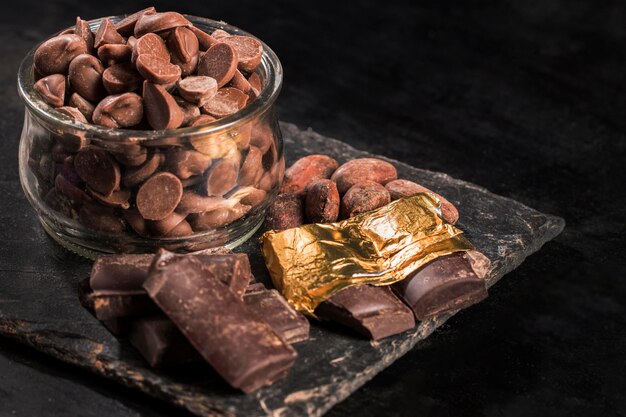 High angle dark assortment with chocolate dessert