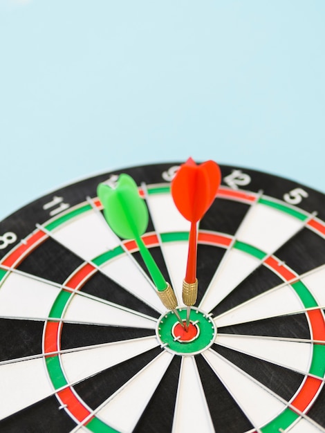 Free photo high angle of darts on bull's-eye