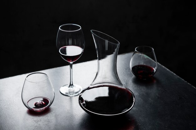 Free photo high angle decanter and wine glasses assortment