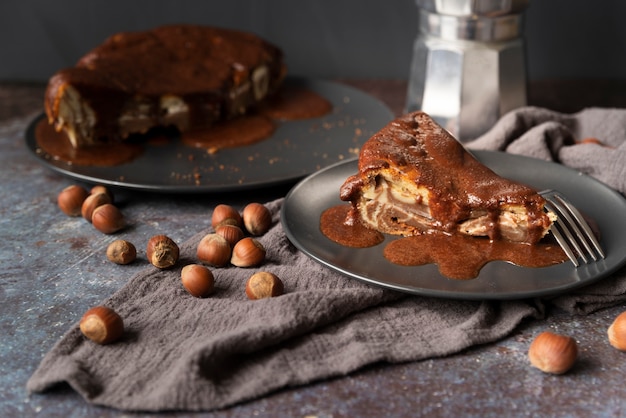 High angle decoration with delicious cake and hazelnuts