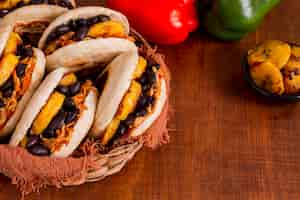 Free photo high angle of delicious arepas in bowl