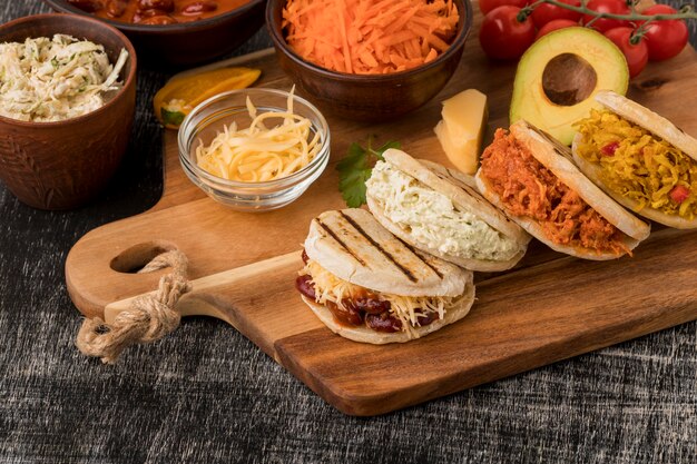 High angle delicious arepas on wooden board