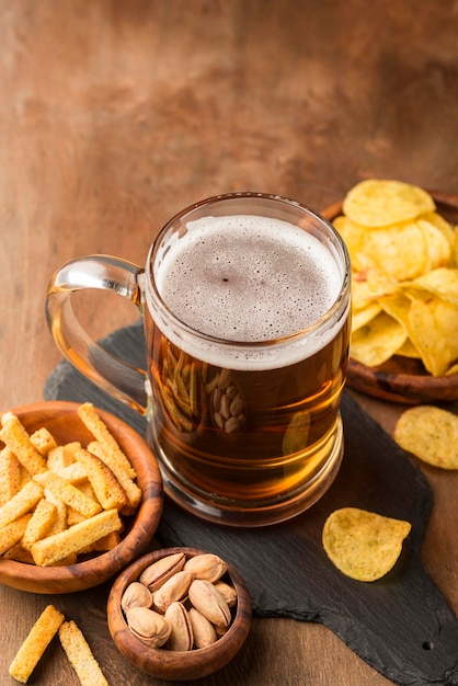 High angle delicious beer mug and chips