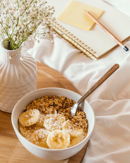 Free photo high angle delicious cereal and banana slices