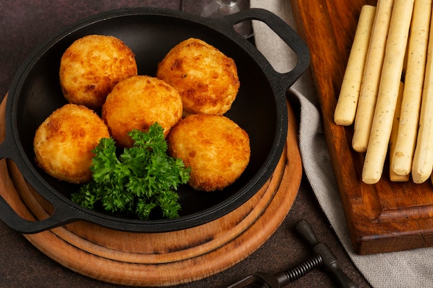 Free photo high angle delicious fried food croquettes