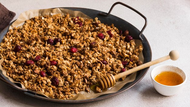 High angle of delicious muesli with honey