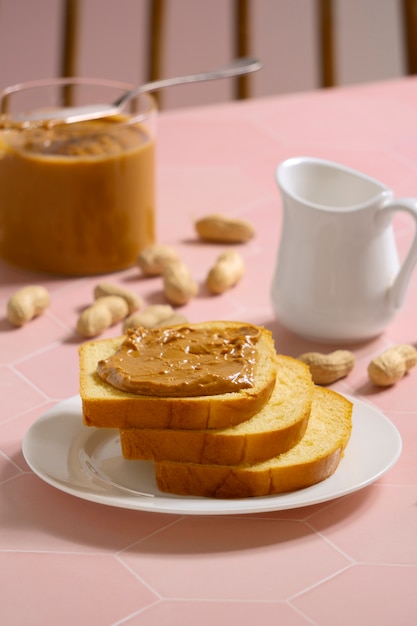 Free photo high angle delicious peanut butter on bread