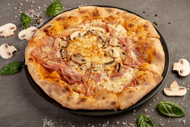 High angle of delicious pizza with mushrooms 