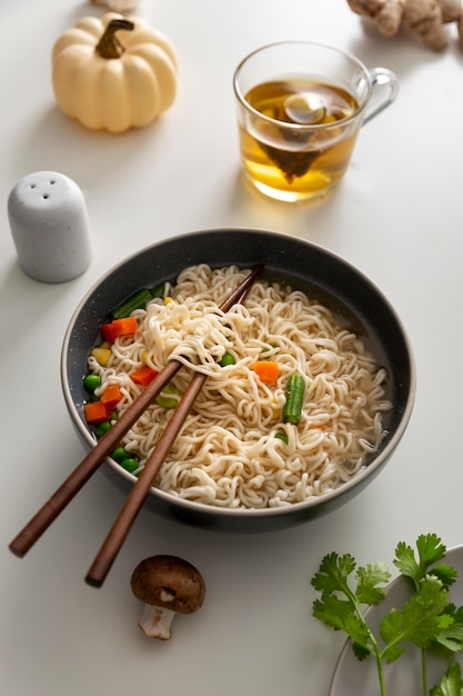 High angle of delicious ramen with chopsticks