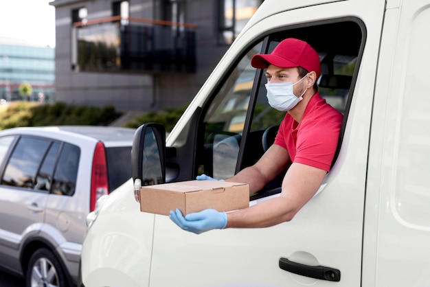 High angle delivery man with mask