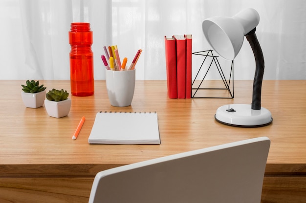 High angle desk arrangement with notebook