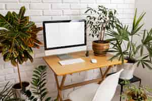 Free photo high angle desk assortment and plants