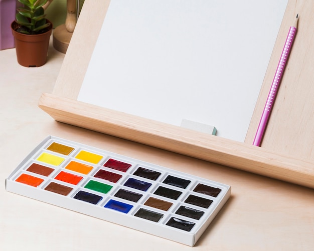 High angle of desk concept with paint and copy space