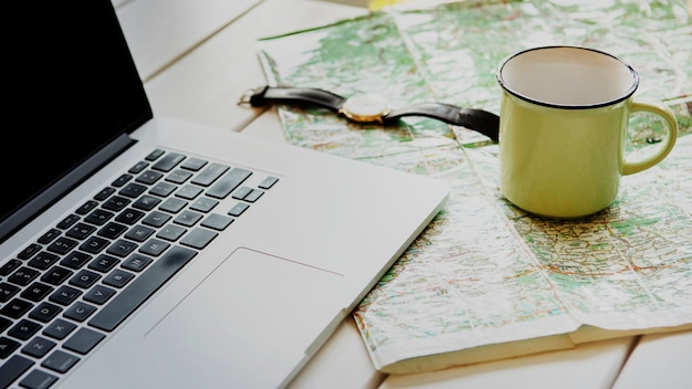 Free photo high angle desk with traveling tools