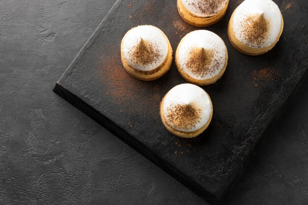 High angle of desserts on slate with copy space