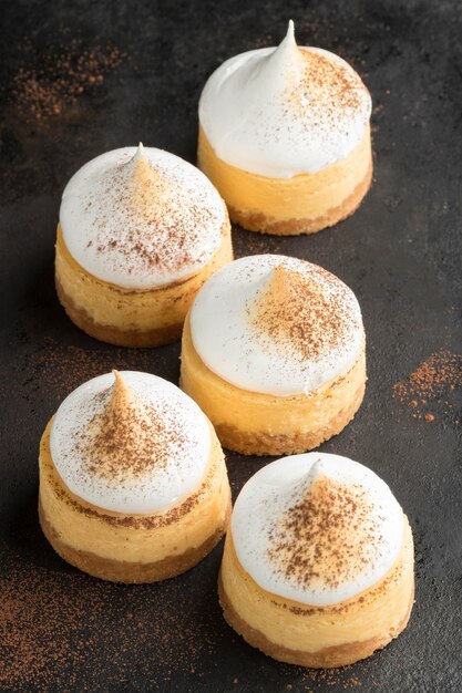 High angle of desserts with cocoa powder and sieve