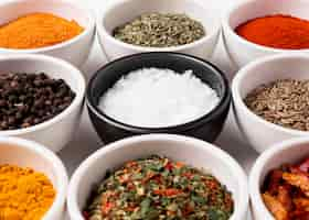 Free photo high angle different bowls of spices