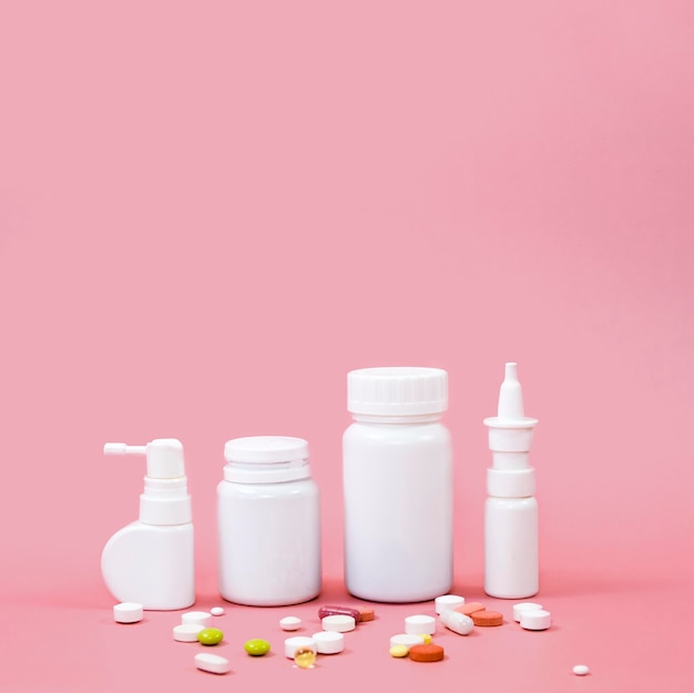 Free photo high angle of different pill containers with copy space