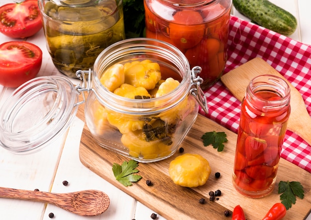 High angle different size jars with vegetables