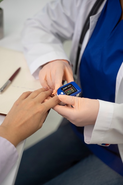 Free photo high angle doctor checking patient