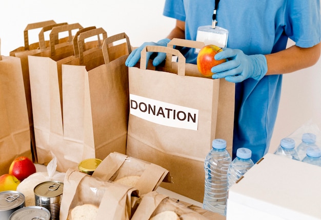 High angle of donation bags with food