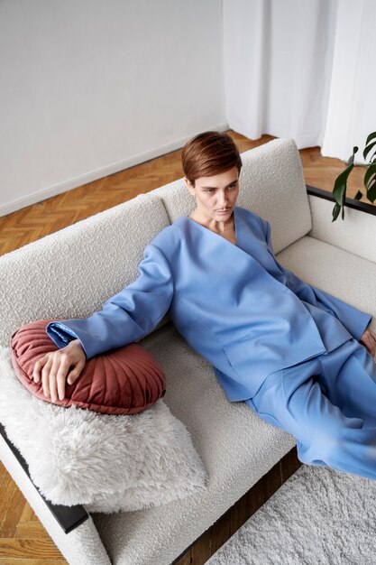High angle drag king laying on couch