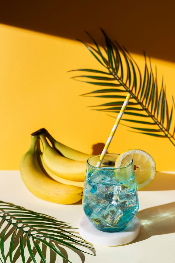 Free Photo high angle drink and bananas arrangement