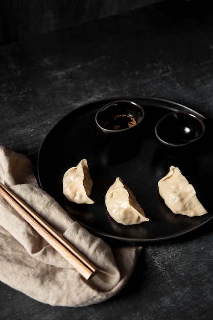Free photo high angle of dumplings and chopsticks