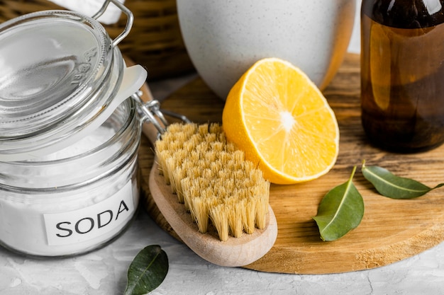 High angle of eco-friendly cleaning brush with lemon and baking soda
