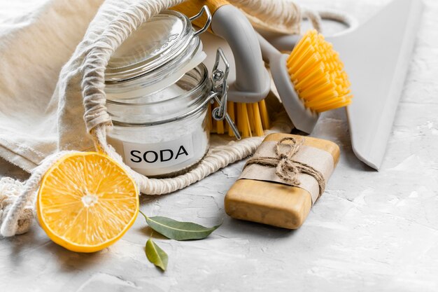 High angle of eco-friendly cleaning brushes with lemon and baking soda