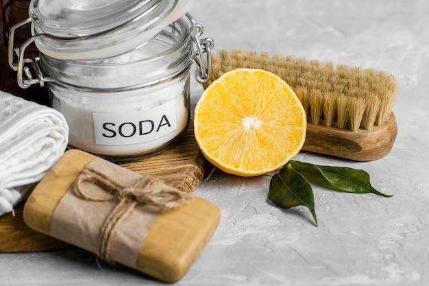 High angle of eco-friendly cleaning products with soap and lemon
