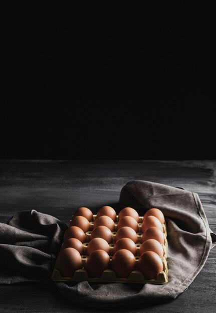 High angle egg package on grey cloth