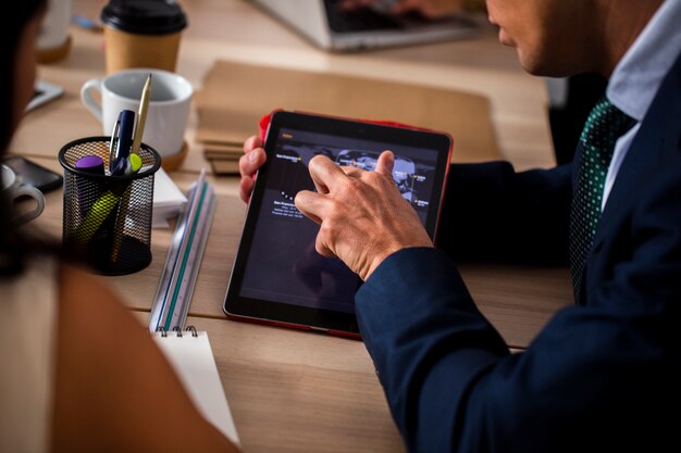 High angle employees using tablet