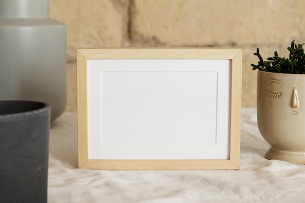 Free photo high angle empty wooden frame