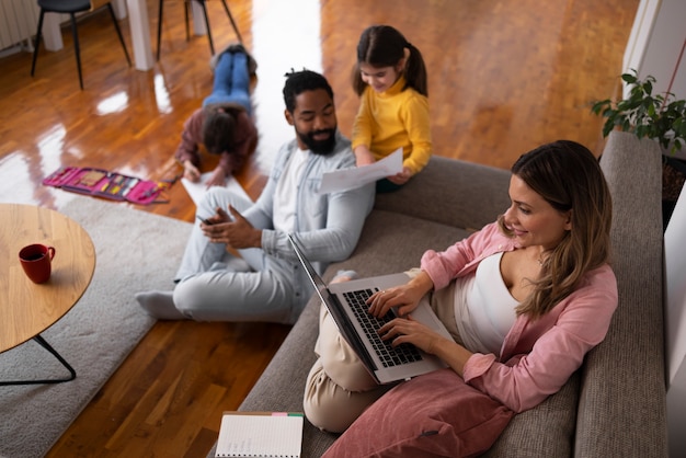 High angle family spending time at home