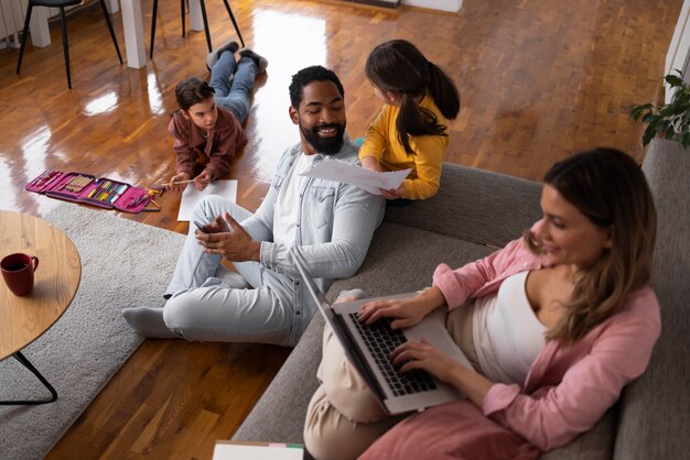 High angle family spending time at home