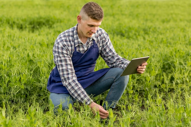 High angle farmer with tablet