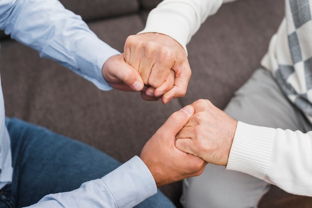 High angle of father and son holding hands