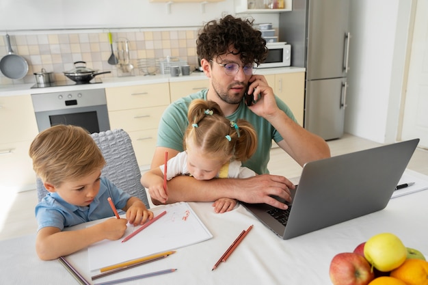 High angle father working from home