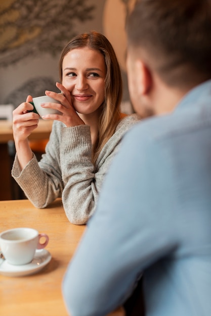 Free photo high angle female listening to friends story