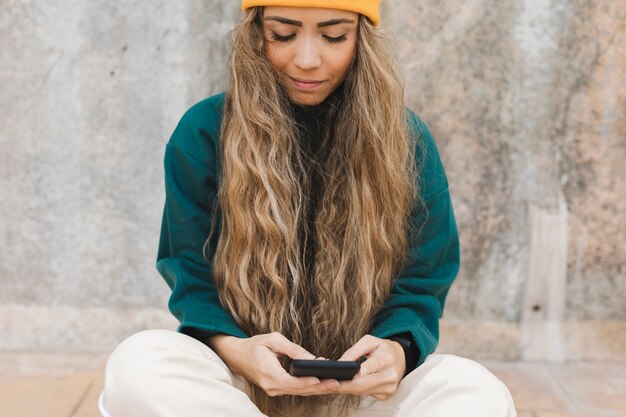 High angle female using mobile