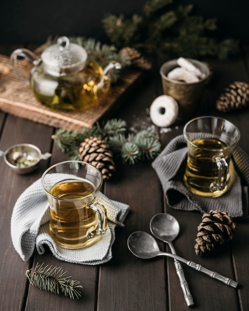 High angle festive arrangement with tea and pine cones