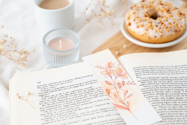 Free photo high angle floral bookmark and book assortment