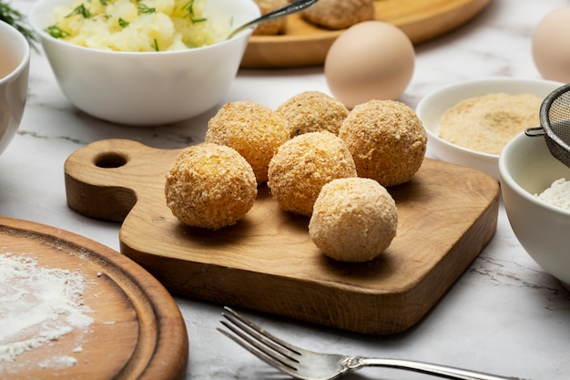 High angle food croquettes on board